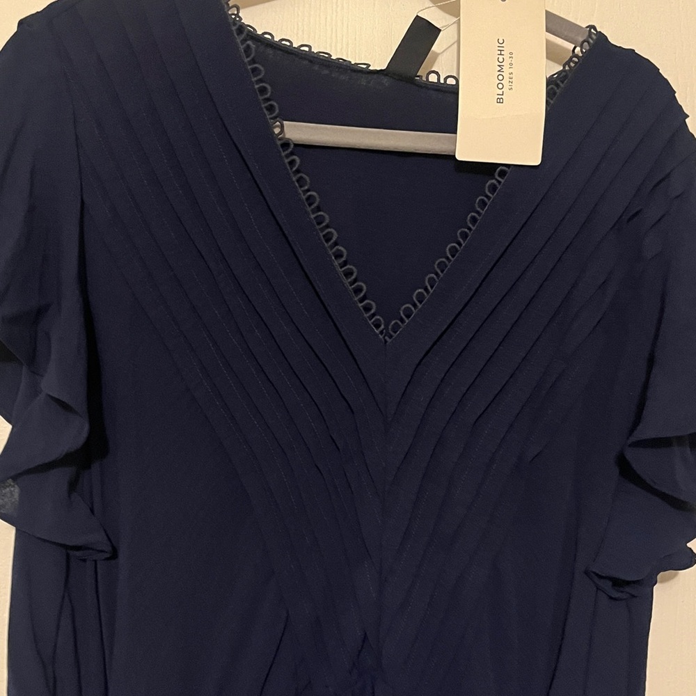 Size 22/24 by Bloomchic. Beautiful fully lined blue chiffon like dress.